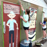 girl scouts painting wall